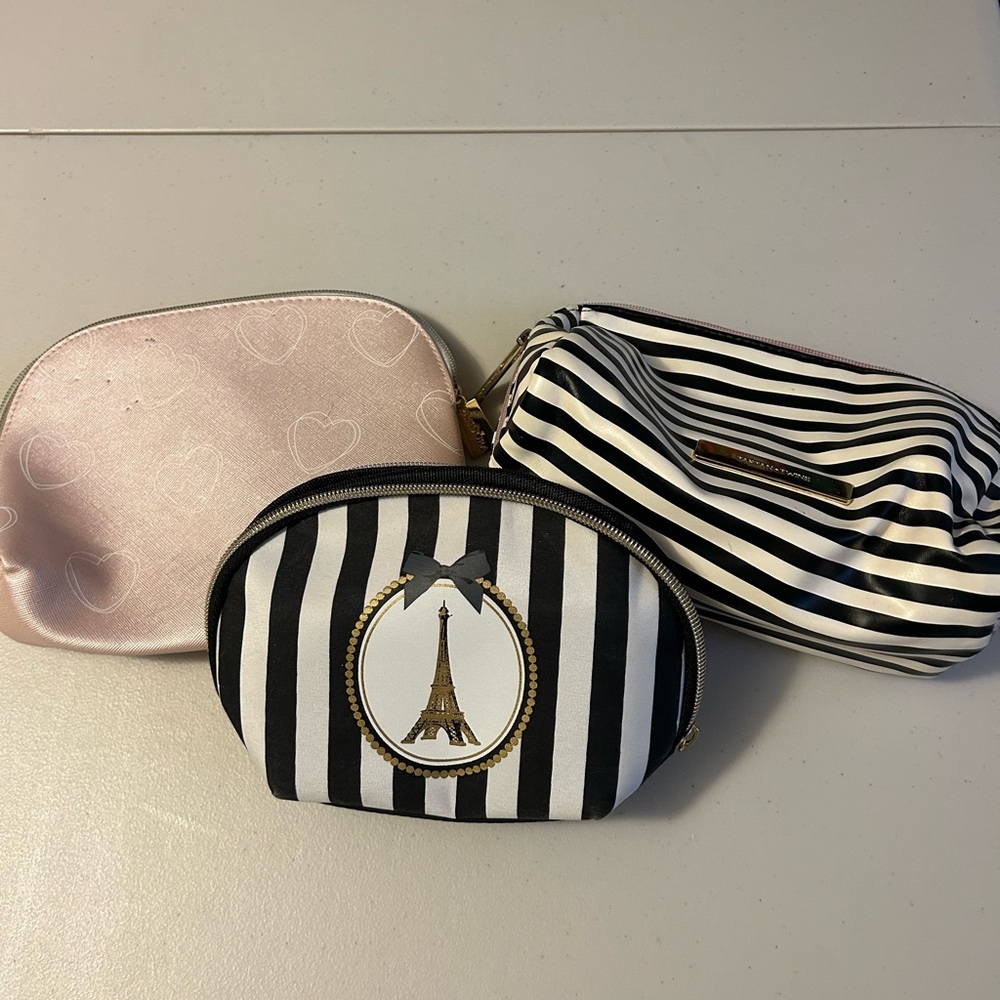 Set of 3 toiletry/cosmetic bags. Very good condition.